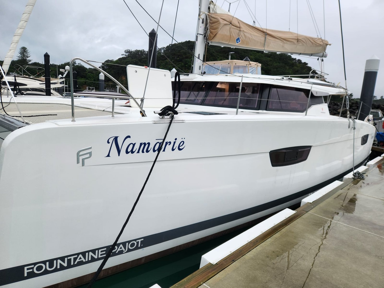 Fountaine Pajot Tanna 47 on the dock before its delivered by yacht delivery solutions skipper and crew with a cloudy sky