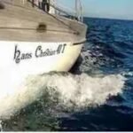A Hans Christian 44 being sailed across the south china sea. the view is from the bow looking aft and you see the hull and a wave. this was taken by the yacht delivery skipper