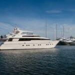 a white power boat by yacht delivery solutions delivery skipper in Thailand with blue sky and sea