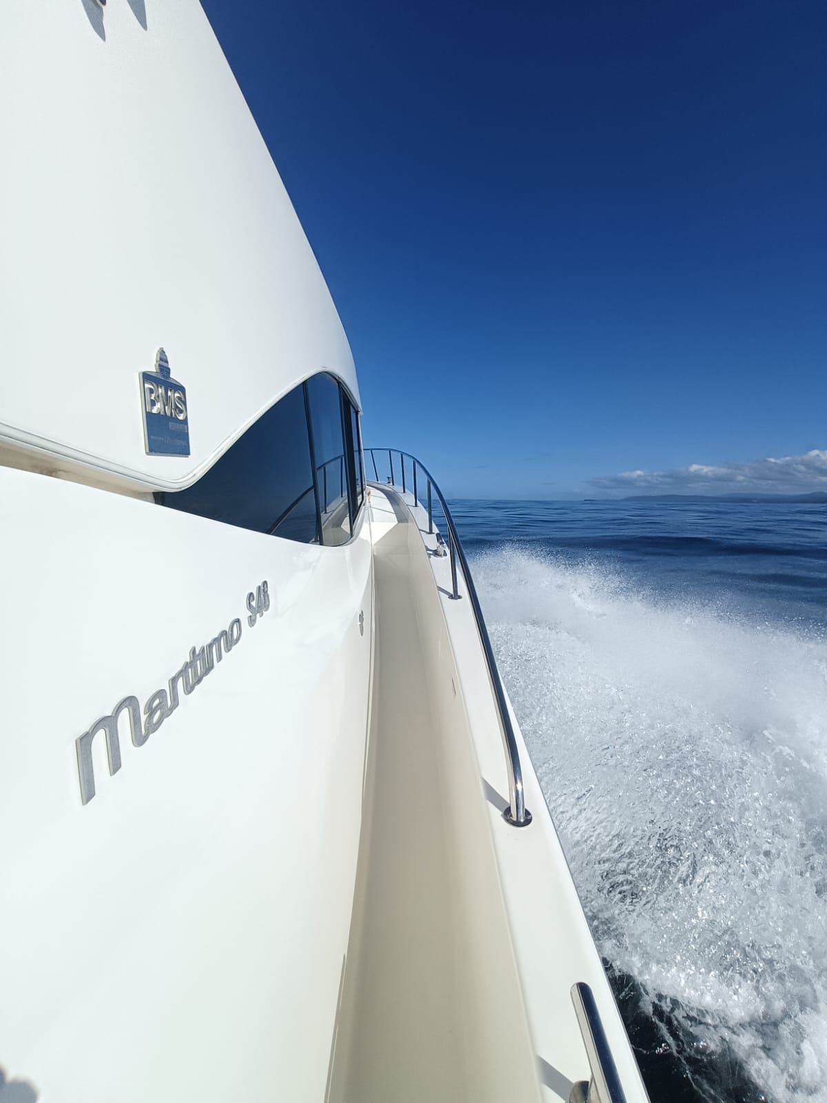 Maritimo S51 logo taken on a delivery by the skipper with a fast white wake and bow splash