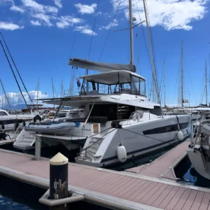 fountaine pajot semana 59 on the dock in tahiti for a yacht delivery with blue sky